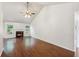 Bright living room featuring a fireplace, hardwood floors, vaulted ceiling, and natural light at 672 Bostonian Way, Lawrenceville, GA 30046