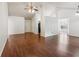 Spacious living room featuring hardwood floors and access to the entry and kitchen area at 672 Bostonian Way, Lawrenceville, GA 30046