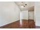 Living room with hardwood floors, neutral paint, and a front entry door at 672 Bostonian Way, Lawrenceville, GA 30046