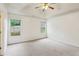 Spacious main bedroom features neutral carpeting, lighted ceiling fan and bright natural light at 672 Bostonian Way, Lawrenceville, GA 30046