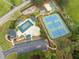 A community aerial view showcasing a pool, tennis courts, and play area at 1126 Gate Post Ct, Powder Springs, GA 30127