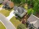 An aerial view of a traditional home showcasing lush landscaping, a large yard and a long driveway at 1126 Gate Post Ct, Powder Springs, GA 30127