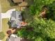 An aerial view shows the layout of this home, including a patio, driveway, mature landscaping and a manicured lawn at 1126 Gate Post Ct, Powder Springs, GA 30127