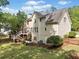 A spacious home featuring a deck, well-maintained lawn, and mature trees in a tranquil setting at 1126 Gate Post Ct, Powder Springs, GA 30127