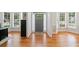 A welcoming foyer showcasing gleaming hardwood floors, large windows and ample natural light at 1126 Gate Post Ct, Powder Springs, GA 30127
