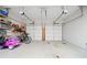 Spacious two-car garage with ample storage, shelving, and room for bicycles and other equipment at 1126 Gate Post Ct, Powder Springs, GA 30127