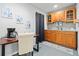 Cozy kitchenette with wooden cabinets, modern appliances, and a small dining area at 1126 Gate Post Ct, Powder Springs, GA 30127