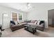 Comfortable living room features a large sectional sofa and bright walls and carpet at 1126 Gate Post Ct, Powder Springs, GA 30127