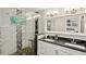 Modern bathroom features a glass-enclosed shower with mosaic accents and a double vanity with dark countertops at 1281 Snapfinger Rd, Decatur, GA 30032