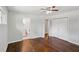 Cozy bedroom with wood floors, ceiling fan, and access to an ensuite bathroom for added convenience at 1281 Snapfinger Rd, Decatur, GA 30032