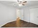 This bedroom features hardwood floors, a ceiling fan, and two closets for ample storage at 1281 Snapfinger Rd, Decatur, GA 30032