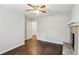 Bright bedroom features hardwood floors, a ceiling fan, and a modern stone fireplace at 1281 Snapfinger Rd, Decatur, GA 30032