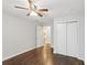 Bedroom features hardwood floors, a ceiling fan, and a double-door closet for ample storage at 1281 Snapfinger Rd, Decatur, GA 30032