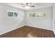Serene bedroom with wood floors, ceiling fan, and windows that fill the room with natural light at 1281 Snapfinger Rd, Decatur, GA 30032