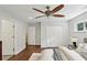 Bright bedroom with hardwood floors, a ceiling fan, and windows for natural light at 1281 Snapfinger Rd, Decatur, GA 30032