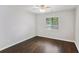 This bedroom features dark hardwood floors and a ceiling fan with integrated lighting at 1281 Snapfinger Rd, Decatur, GA 30032