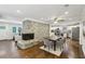 Inviting dining area boasts a stone fireplace, hardwood floors, and an open layout to the kitchen at 1281 Snapfinger Rd, Decatur, GA 30032
