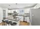 Modern kitchen with granite counters, stainless steel appliances, and a breakfast bar for casual dining at 1281 Snapfinger Rd, Decatur, GA 30032