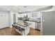 Bright kitchen featuring stainless steel appliances, granite countertops, pendant lighting, and modern finishes at 1281 Snapfinger Rd, Decatur, GA 30032