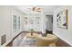Bright living room features built-in shelving, a ceiling fan, and French doors to the outside at 1281 Snapfinger Rd, Decatur, GA 30032