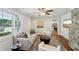 Comfortable living room boasts hardwood floors, a stone fireplace, and an open floor plan at 1281 Snapfinger Rd, Decatur, GA 30032