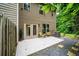 Charming backyard patio area with seating and access to the main house at 2450 Norwood Park Xing, Atlanta, GA 30340