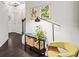Beautifully decorated hallway with hardwood floors, wall art, and a stylish console table at 2450 Norwood Park Xing, Atlanta, GA 30340