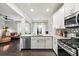 Modern kitchen featuring stainless steel appliances, granite countertops, and hardwood floors at 2450 Norwood Park Xing, Atlanta, GA 30340