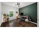 Cozy home office space with ample workspace and natural light from a window at 2450 Norwood Park Xing, Atlanta, GA 30340