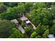 Lush aerial view of the property showcasing mature trees, manicured landscaping, and the charming home exterior at 26 Clarendon Ave, Avondale Estates, GA 30002