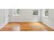 Bright bedroom with hardwood flooring and plenty of natural light from the windows at 26 Clarendon Ave, Avondale Estates, GA 30002