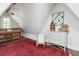Attic bedroom features a cozy bunk bed and charming decor with a red rug at 26 Clarendon Ave, Avondale Estates, GA 30002