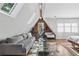 Airy bedroom with natural light has hardwood floors, comfortable seating and a cozy en-suite bath at 26 Clarendon Ave, Avondale Estates, GA 30002