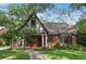 Inviting two-story home with lush landscaping, a stone walkway, and a cozy front porch at 26 Clarendon Ave, Avondale Estates, GA 30002