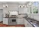 Modern kitchen showcasing stainless steel oven, cooktop, custom cabinets, and dark countertops at 26 Clarendon Ave, Avondale Estates, GA 30002