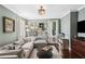 Cozy living room boasts natural light, hardwood floors, and stylish decor at 26 Clarendon Ave, Avondale Estates, GA 30002