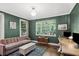 Inviting living room showcasing large windows, hardwood floors, and plenty of light at 26 Clarendon Ave, Avondale Estates, GA 30002
