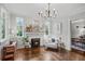Bright living room with fireplace, hardwood floors, and ample natural light at 26 Clarendon Ave, Avondale Estates, GA 30002