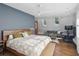 Spacious main bedroom offers hardwood floors, comfortable seating, natural light, and en-suite bathroom at 26 Clarendon Ave, Avondale Estates, GA 30002