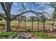 A community playground with whimsical birdhouses, mature trees, and play equipment offers a delightful outdoor space at 26 Clarendon Ave, Avondale Estates, GA 30002