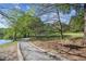 Scenic walking path by the lake with a bench and lush trees, perfect for outdoor enjoyment at 26 Clarendon Ave, Avondale Estates, GA 30002
