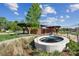 A serene water feature with a modern fountain, native landscaping, and a covered pavilion enhances the outdoor space at 26 Clarendon Ave, Avondale Estates, GA 30002