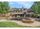 Stunning backyard with a swimming pool, outdoor kitchen, and ample lounge space at 351 Old Orchard Ct, Marietta, GA 30068