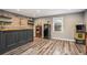 Finished basement bar area with unique stone wall and a vintage refrigerator at 351 Old Orchard Ct, Marietta, GA 30068
