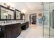 Bright bathroom with double vanities, and an entrance to a shower room with hardwood floors at 351 Old Orchard Ct, Marietta, GA 30068