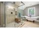 Luxurious bathroom with a glass-enclosed shower, freestanding tub, and designer fixtures at 351 Old Orchard Ct, Marietta, GA 30068