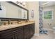 Bathroom featuring double sinks, granite counters, and modern fixtures at 351 Old Orchard Ct, Marietta, GA 30068