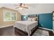 Bedroom with a comfortable bed, hardwood floor and blue accent wall at 351 Old Orchard Ct, Marietta, GA 30068