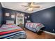 ' bedroom with two twin beds, hardwood floors, ceiling fan, and window with natural light at 351 Old Orchard Ct, Marietta, GA 30068