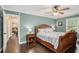 Comfortable bedroom with hardwood floors, ceiling fan, and natural light from the window at 351 Old Orchard Ct, Marietta, GA 30068